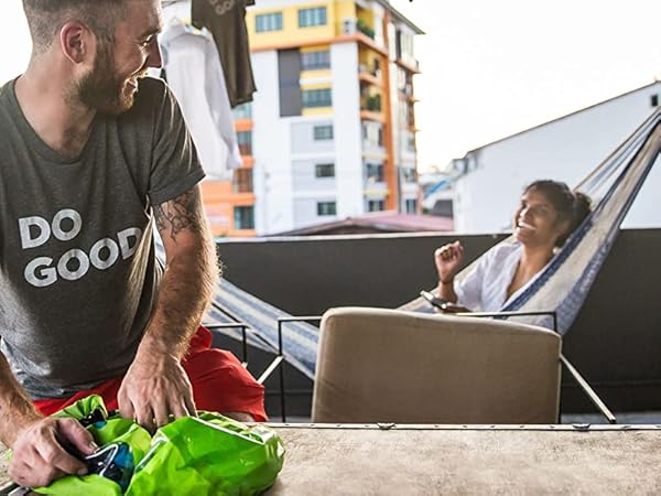 Man using Scrubba countertop washing machine wash bag hostel 