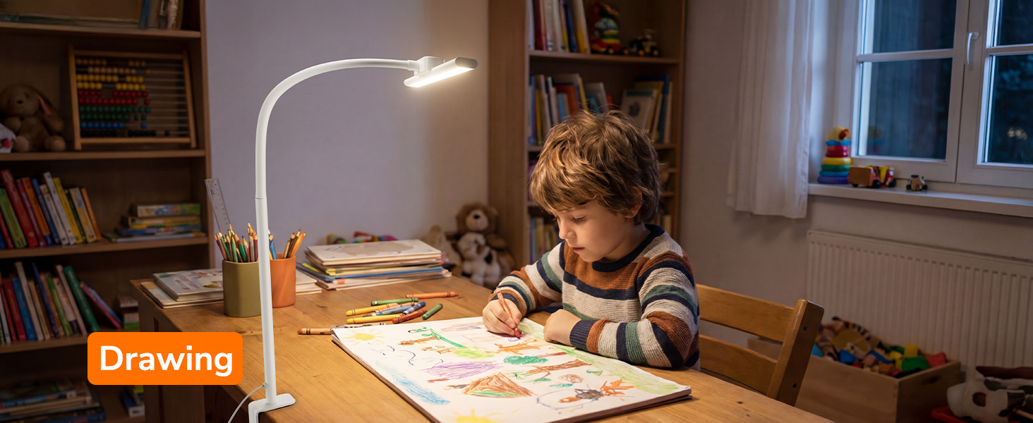 Text reads 'Drawing'. Peaceful study environment showing desk with lamp illuminating workspace where someone does homework or drawing.