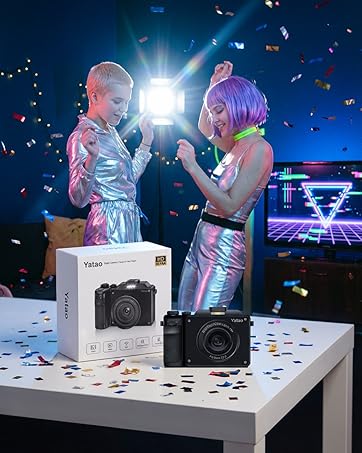 Two young people are dancing, attending a birthday party, with yatao digital camera as a gift