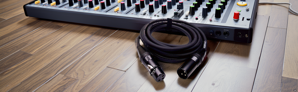 A sleek and modern recording studio setup with the product cable neatly organized and connected to v