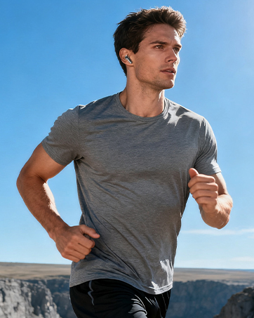Series of outdoor running shots showing athletic activity against a desert landscape backdrop. Subject wearing gray t-shirt during exercise.