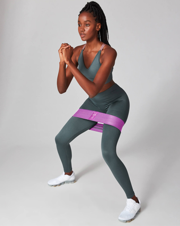 women do butt workout with pink booty bands