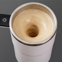 Self stirring coffee cup