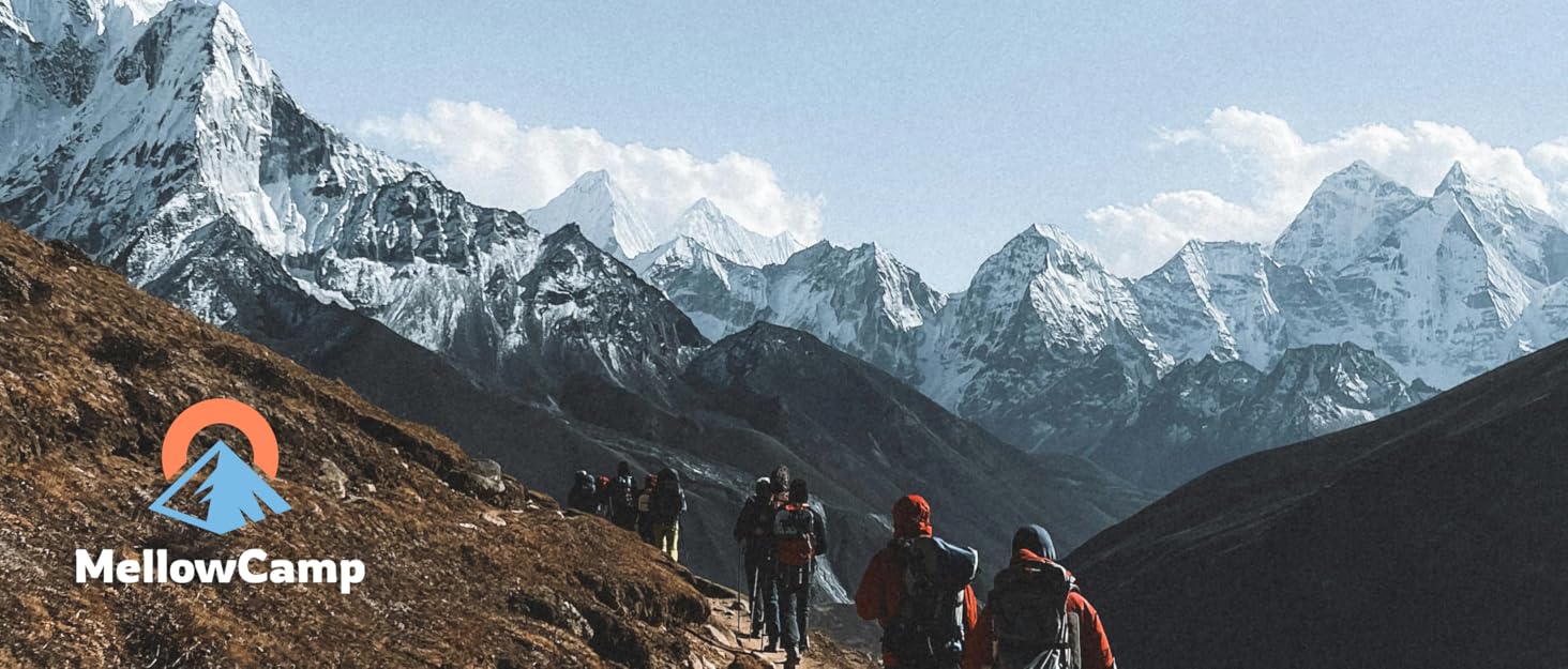 A group of camping enthusiasts are hiking towards a range of continuous, snow-white mountains.