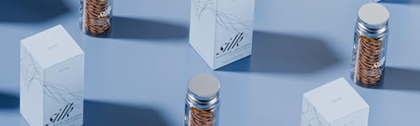 Silk floss and it&amp;#39;s packaging in a pattern