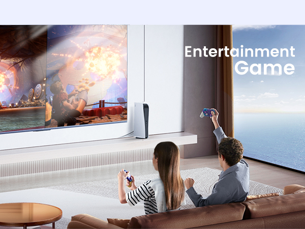 Two people playing a motion-controlled video game on a large TV in a living room with ocean view. 'Entertainment Game' text visible.
