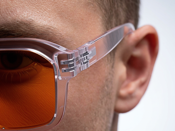 metalless screwless spring hinge mechanism flexing outward, demonstrating flexibility and innovativ