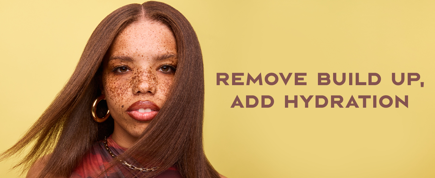 Image of a black woman with freckles &amp;amp; straight hair next to text: &amp;#34;remove build up, add hydration&amp;#34;.