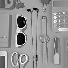 black earbuds top view with a watch, calculator, markers, sunglasses, binder clips