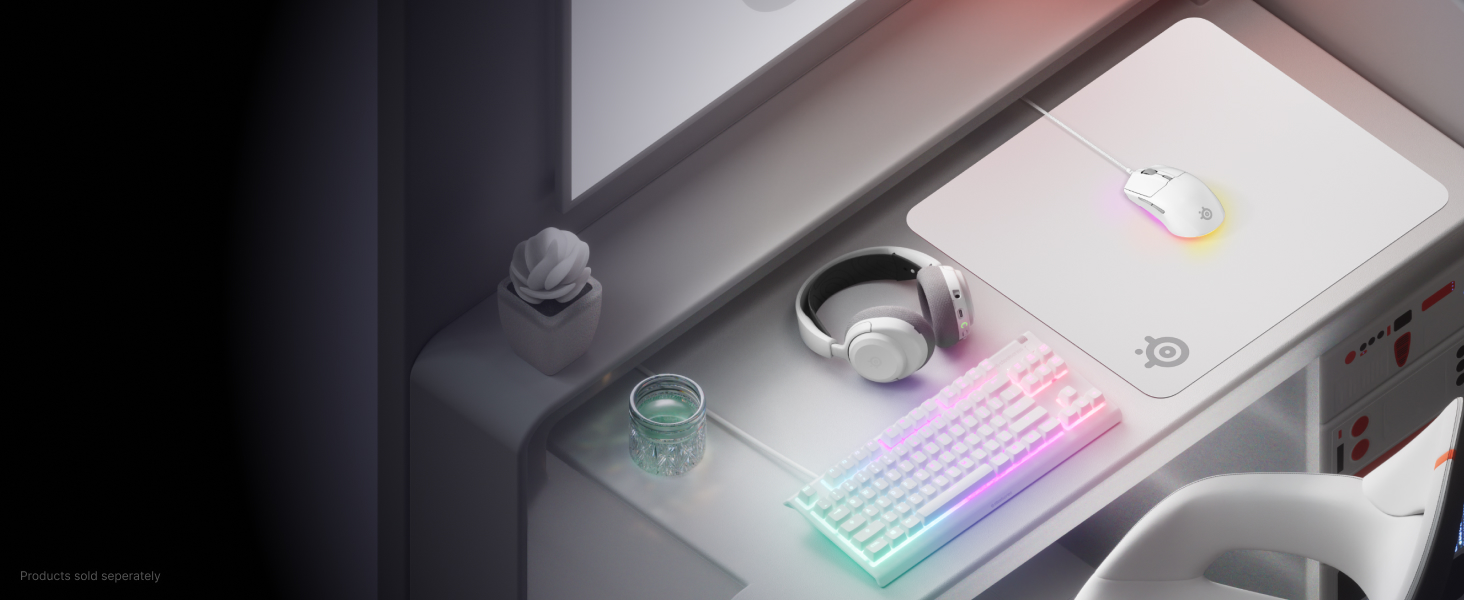 Desktop setup with a keyboard, mouse, headset, and mouse pad