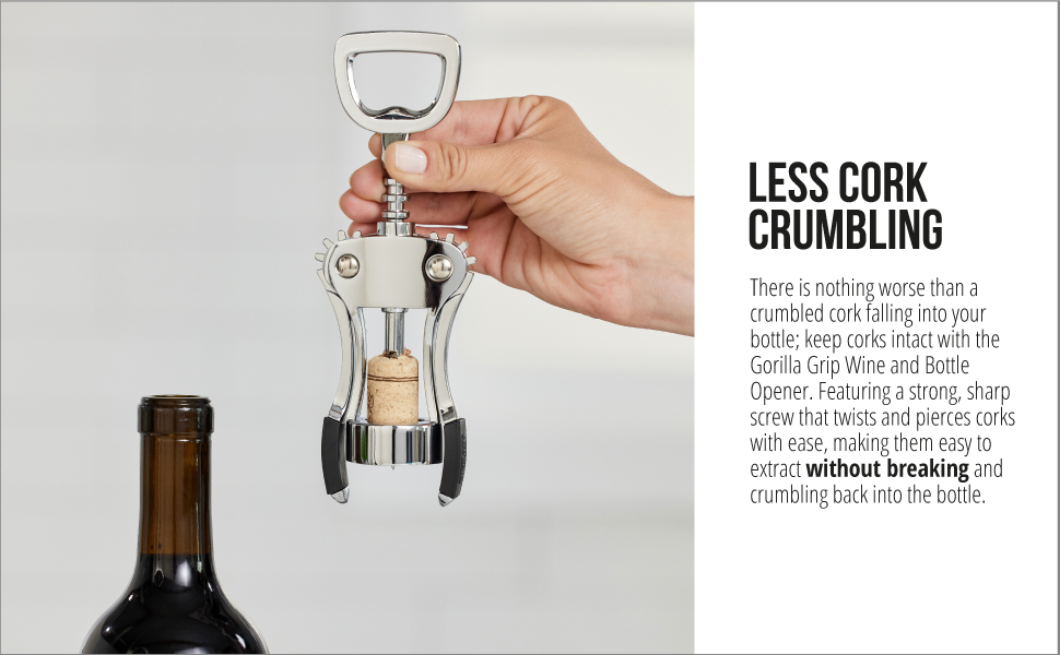 hand holding wine opener with cork