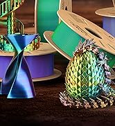 a group of different colored ribbons and a pineapple.