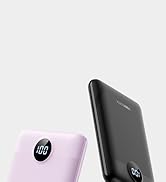 Two power banks shown against white background - one black and one pink, both featuring digital displays showing battery percentage.