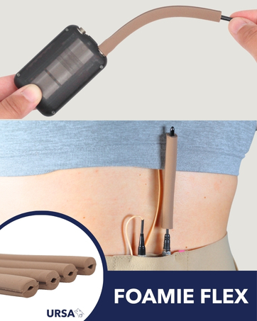 Text reads 'FOAMIE FLEX'. Close-up product demonstration showing black device with copper-colored attachment against white and blue background.