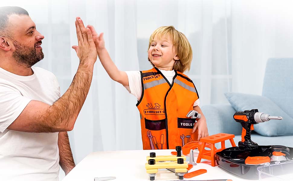 Orange toy tool set including safety vest and plastic construction tools spread on a light-colored surface.
