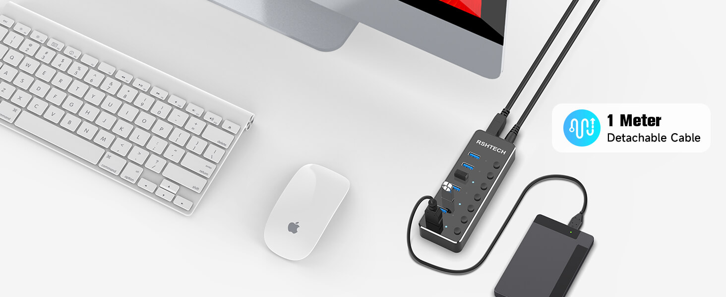 USB hub with multiple ports connected to a laptop charger and external drive. Keyboard and mouse visible. Text indicates '1 Meter Detachable Cable'.
