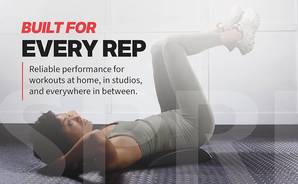 Woman using SPRI ab mat for core exercise demonstrating comfort and support during workouts