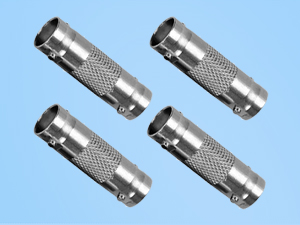 Four silver metal cylindrical connectors with textured grips and smooth ends. Each connector has a small protrusion on one side, likely for cable attachment.