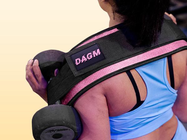 Woman using hip thrust belt for barbell squats in the gym