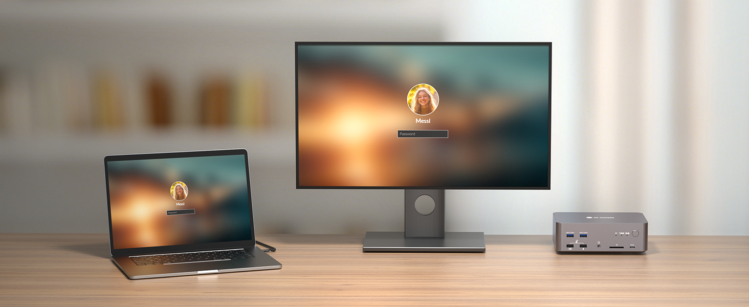Desktop workstation setup showing laptop and external monitor on wooden desk, with small peripheral device. Both screens display same lock screen icon against blurred background.