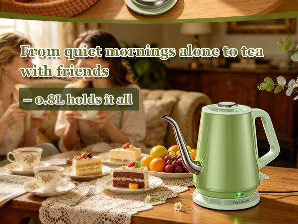 Smiling professional enjoying a warm cup of tea prepared with fast heating kettle at home