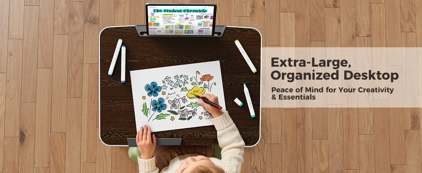 Child drawing on an extra-large folding laptop table used as a collapsible creative desk.