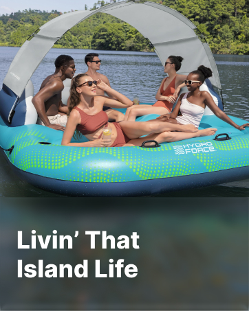 People relax in a inflatable island with text &amp;#34;Livin&amp;#39; That Island Life&amp;#34;