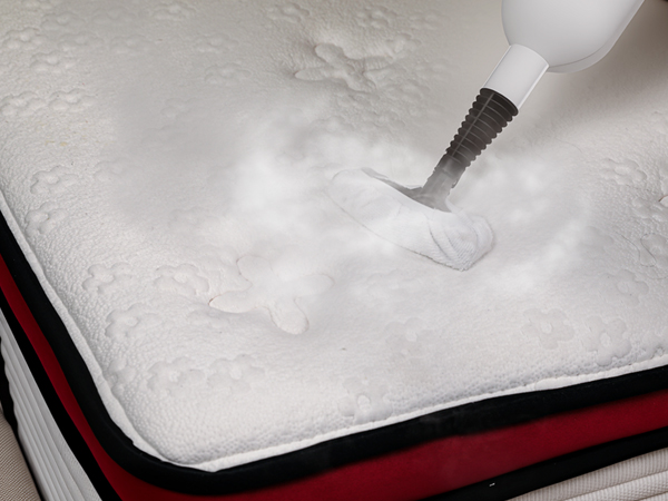 steam mop cleaning mattress in bedroom