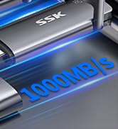 Close-up of electronic device with blue LED lighting displaying '1000MB/s' text.