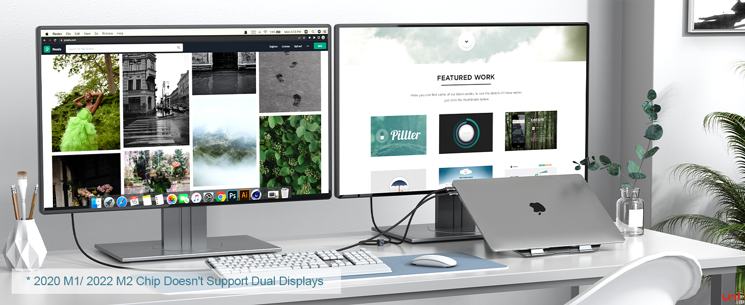 Home office setup with dual monitor display, laptop, keyboard, and mouse on a white desk. Monitors show various images and applications.