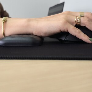 Nicwe wrist rest in use with gaming mouse, neutral hand posture for computer work.