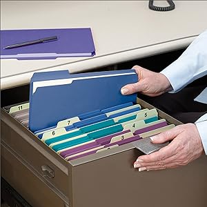 Smead colored file folders, office setting, desk drawer, black pen and telephone