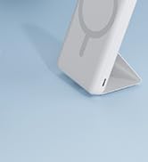 Close-up detail of white footwear or shoe base against light blue background, showing bottom sole area.