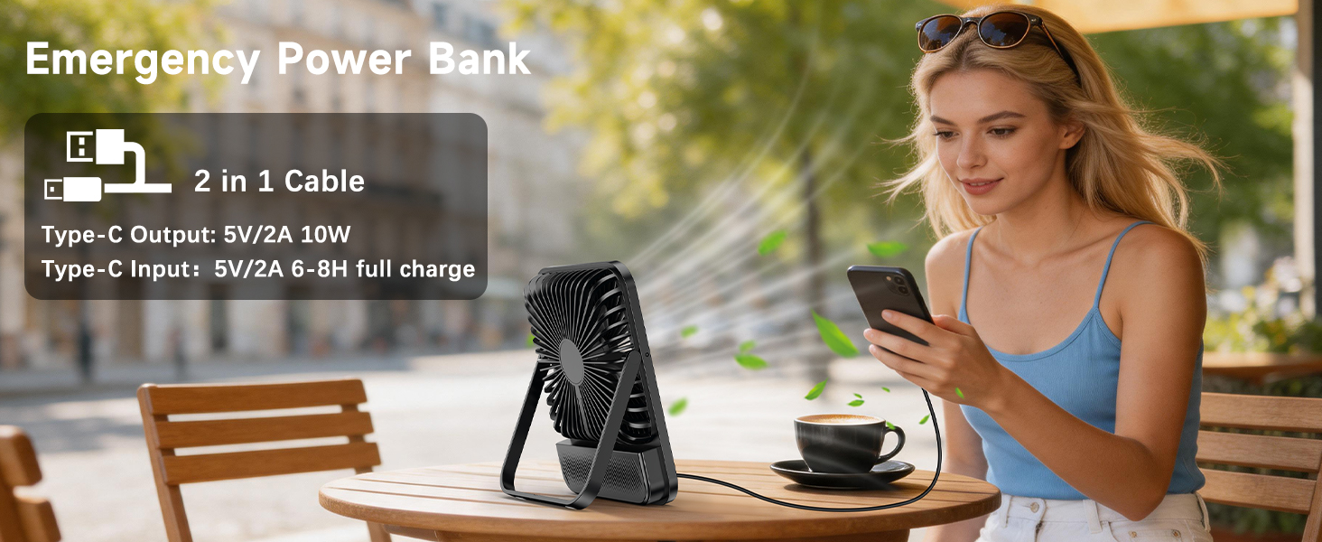 Text reads 'Emergency Power Bank' and '2 in 1 Cable' with 'Input: Micro USB Type-C Output: 5V USB &amp; Micro Charge'. Woman outdoors with power bank and coffee cup on table.