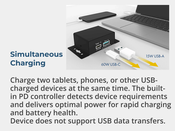 Compact USB-C PD power adapter charging phone and laptop simultaneously on desktop