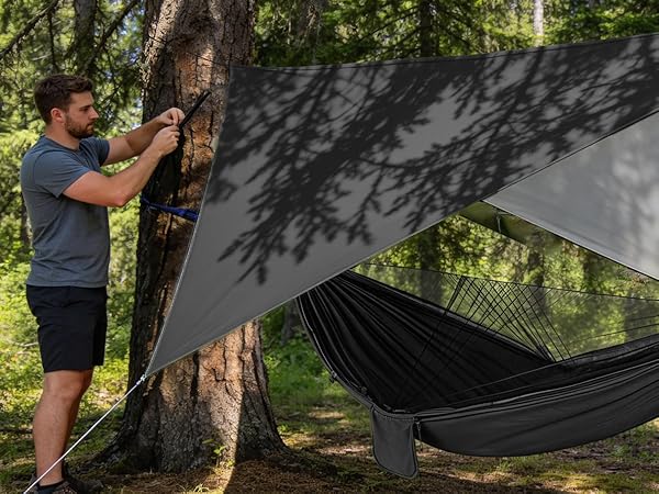 Series of outdoor shots showing a hammock or camping setup between trees in a forested setting.