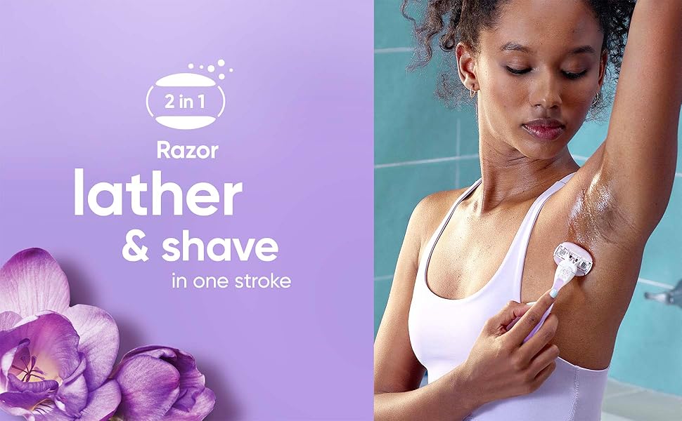 Woman shaving underarms with 2-in-1 Gillette Venus ComfortGlide Freesia razor that lathers.
