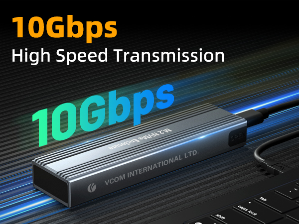 High-speed data transmission device, 10Gbps capability, rectangular metal casing with fins, connected to a laptop or computer via cable.