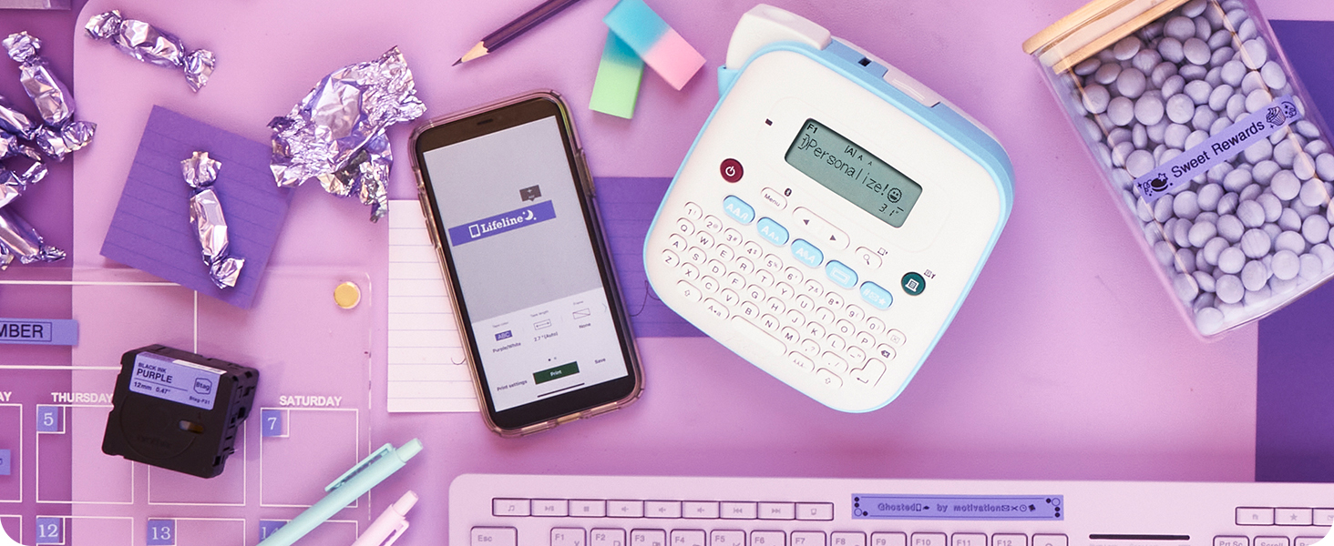 PT-N25BT labeler with purple labels with white or black text on calendar, keyboard with inspiration