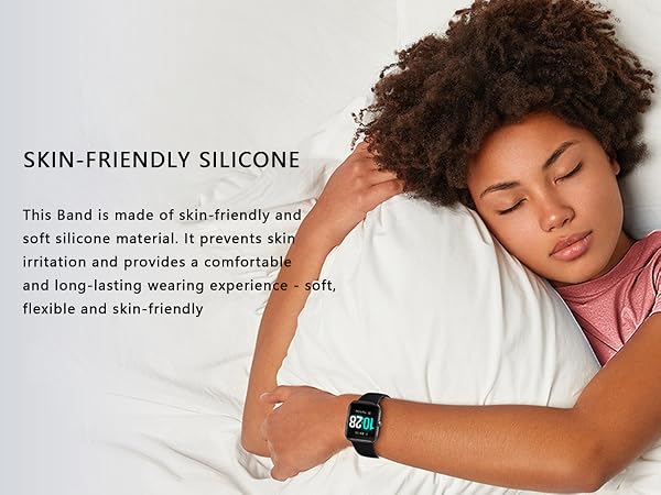 a woman is laying on a pillow with a watch on her wrist.