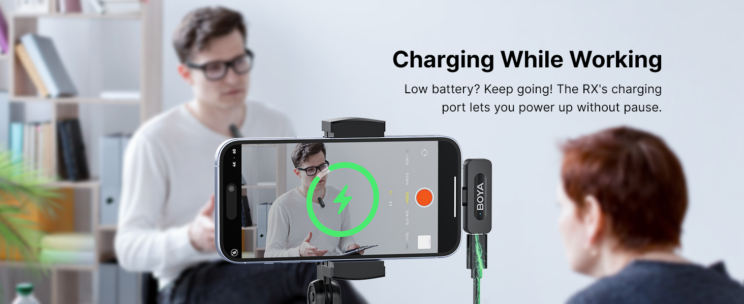 Smartphone mounted on a stand with charging capability, displaying video call interface with 'Charging While Working' text overlay.