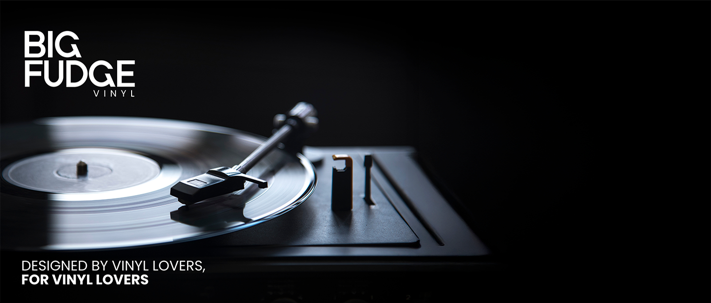 Text reads 'BIG FUDGE' and 'DESIGNED BY VINYL LOVERS, FOR VINYL LOVERS'. Close-up of turntable tonearm and record player components against dark background.