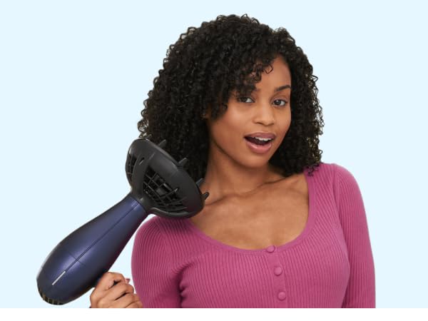 Woman using diffuser attachment