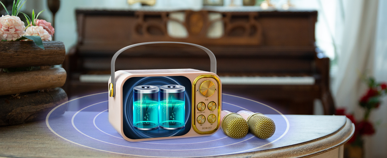 Portable device with blue illuminated display and gold control panel, sitting on round table with decorative objects nearby.