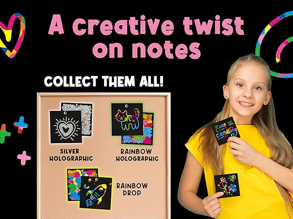 Child proudly displaying completed rainbow scratch art, highlighting creativity and self-expression.