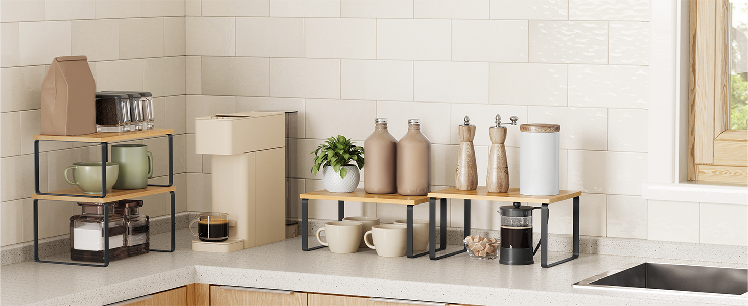 Kitchen countertop with tiered metal shelves holding various containers, bottles, and a plant. Organizational units maximize counter space and storage.