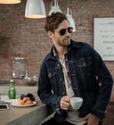 3.3 J+S Vision Ariki Sunglasses - man wearing square aviator sunglasses in a cafe