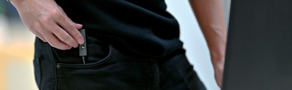 a person putting creative sound blaster play4 into his pocket