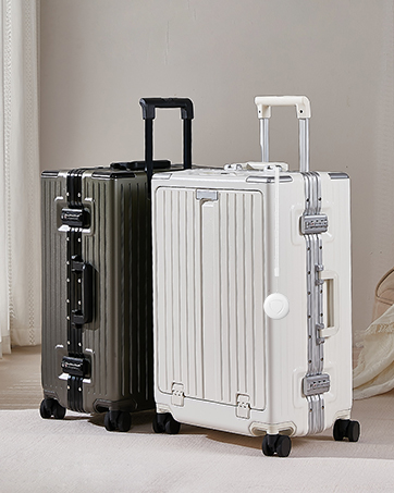 Two hardshell rolling suitcases with vertical ridged design, shown in black and white colors with telescoping handles.