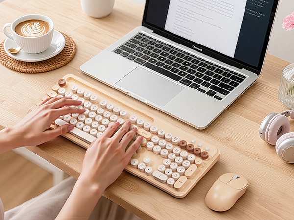 Stylish wireless keyboard and mouse brighten a cozy home workspace, keeping typing smooth